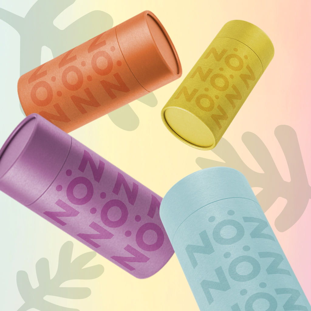 Red, yellow, green and purple Noz sunscreen floating