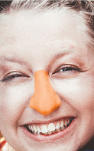 Load image into Gallery viewer, Closeup of woman with orange Noz sunscreen on nose
